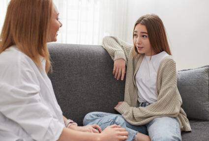 Mother And Daughter Talking To Each Other At Home 2023 11 27 04 49 29 Utc
